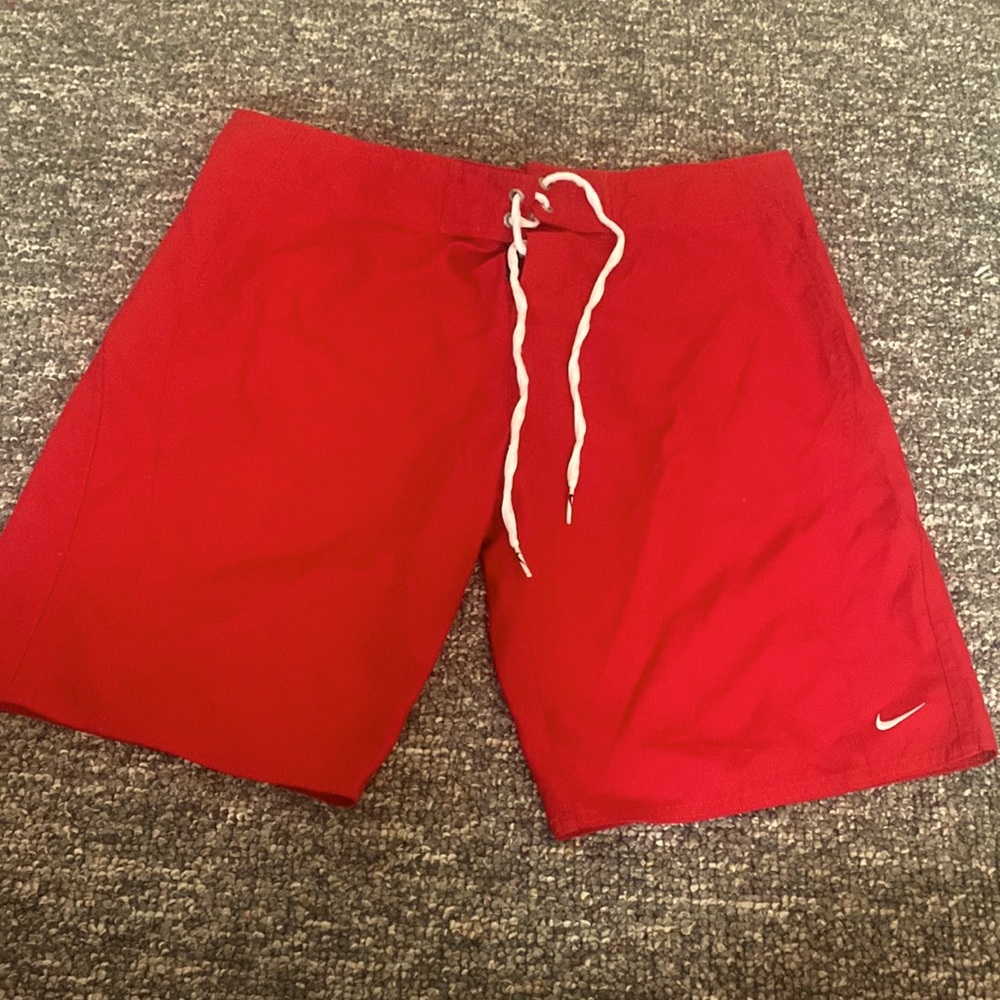 Red Nike swim trunks